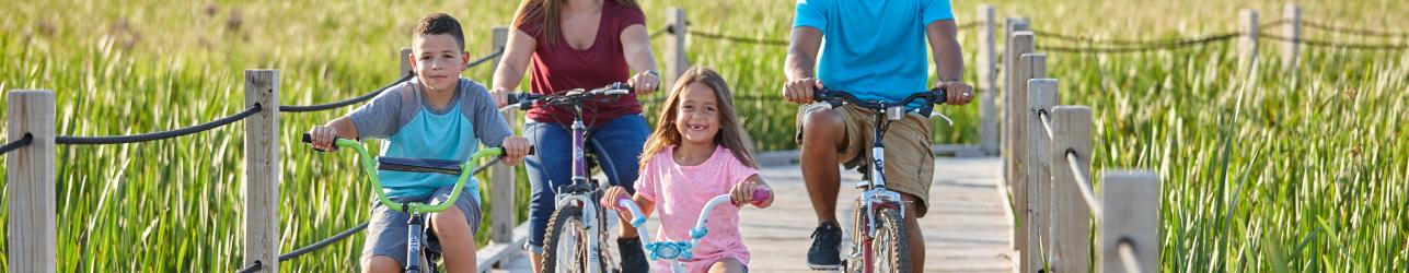 Family riding bikes in horicon marsh