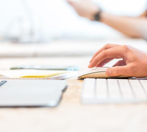 Person clicking on computer