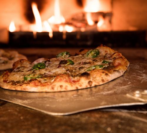 Pizza baking in oven
