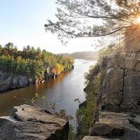 A river flowing down beautiful rocks and trees
