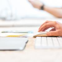 Person clicking on computer