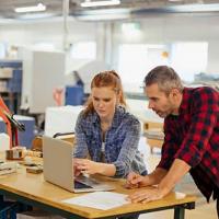 business owners looking at computer
