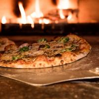 Pizza baking in oven