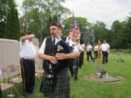 Piper Bill Mcinnes led the honor guard onto the field. 
