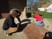 Students working on stone road. 