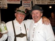 Two men with beer mug at Volkfest