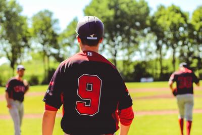 Adult in baseball shirt in park