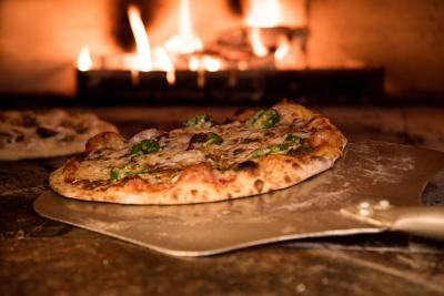 Pizza baking in oven